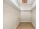 Spacious walk-in closet featuring ample shelving and modern wood floors at 1820 Johnson Rd, Burlington, NC 27217