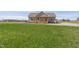 A single-story home with a welcoming front porch surrounded by a green lawn at 1820 Johnson Rd, Burlington, NC 27217