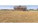 Charming home with a welcoming porch, a red door, and a spacious front yard at 1820 Johnson Rd, Burlington, NC 27217