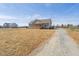 Inviting home with a cozy front porch, a red door, and a long driveway at 1820 Johnson Rd, Burlington, NC 27217