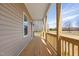 Long front porch offering ample space to enjoy the outdoors and view at 1820 Johnson Rd, Burlington, NC 27217