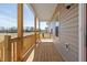 Spacious front porch with wood flooring and railing, great for relaxing at 1820 Johnson Rd, Burlington, NC 27217