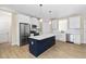 Well-equipped kitchen featuring stainless steel appliances, a spacious island, and modern cabinetry at 1820 Johnson Rd, Burlington, NC 27217