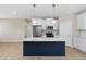 Stylish kitchen island featuring white countertops and a navy base, with modern appliances at 1820 Johnson Rd, Burlington, NC 27217