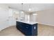 Kitchen featuring a large island with white countertop, stylish cabinets, and modern fixtures at 1820 Johnson Rd, Burlington, NC 27217