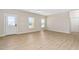 Bright and airy living room with neutral walls, wood flooring, and a view of the outdoors at 1820 Johnson Rd, Burlington, NC 27217