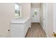 Convenient mud room featuring white cabinetry, light counters, and easy exterior access at 1820 Johnson Rd, Burlington, NC 27217