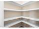 Corner pantry features custom shelving and ample space for storage at 1820 Johnson Rd, Burlington, NC 27217