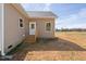 Alternative side entrance with a door, wooden steps, and peaceful surroundings at 1820 Johnson Rd, Burlington, NC 27217