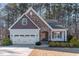 Charming Craftsman style home with stone accents and a two-car garage at 201 Laurel Oaks Dr, Youngsville, NC 27596