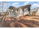 House exterior showcasing a screened porch and backyard at 201 Laurel Oaks Dr, Youngsville, NC 27596