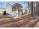 Rear view of the house with a large screened porch at 201 Laurel Oaks Dr, Youngsville, NC 27596