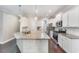 Modern kitchen with white cabinets, granite countertops, and stainless steel appliances at 201 Laurel Oaks Dr, Youngsville, NC 27596
