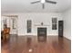 Relaxing living room with fireplace, hardwood floors, and access to back porch at 201 Laurel Oaks Dr, Youngsville, NC 27596
