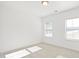 Spacious bedroom with two windows and light-colored carpet at 2029 Maggie Valley Dr, Apex, NC 27502