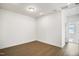 Simple bedroom with wood flooring and access to hallway at 2029 Maggie Valley Dr, Apex, NC 27502