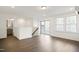 Spacious bonus room with hardwood floors and access to a deck at 2029 Maggie Valley Dr, Apex, NC 27502