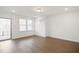 Bright bonus room with hardwood floors and sliding glass doors to deck at 2029 Maggie Valley Dr, Apex, NC 27502