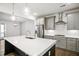 Modern kitchen with stainless steel appliances and white cabinets at 2029 Maggie Valley Dr, Apex, NC 27502