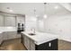 Modern kitchen with stainless steel appliances and island at 2029 Maggie Valley Dr, Apex, NC 27502