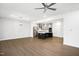 Open concept kitchen and living area with island and hardwood floors at 2029 Maggie Valley Dr, Apex, NC 27502