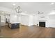 Open concept kitchen and living area with island and fireplace at 2029 Maggie Valley Dr, Apex, NC 27502