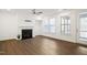 Bright living room with fireplace and hardwood floors at 2029 Maggie Valley Dr, Apex, NC 27502