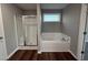 Bathroom with shower and bathtub, and vinyl flooring at 228 Mahogany Way, Four Oaks, NC 27524