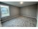 Bright bedroom with window and neutral wall colors at 228 Mahogany Way, Four Oaks, NC 27524