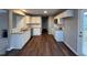 Modern kitchen with white cabinets, granite countertops, and stainless steel appliances at 228 Mahogany Way, Four Oaks, NC 27524