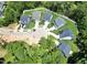 A high angle aerial view of a circle of homes with lush tree coverage surrounding the community at 2628 Silver Gate Ct, Wake Forest, NC 27587