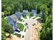 An aerial view of a home community showcasing charming homes surrounded by lush greenery at 2628 Silver Gate Ct, Wake Forest, NC 27587