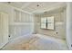 Empty bedroom with unfinished walls and a large window at 2628 Silver Gate Ct, Wake Forest, NC 27587