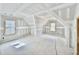 Unfinished bonus room with vaulted ceiling and multiple windows at 2628 Silver Gate Ct, Wake Forest, NC 27587