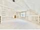 Unfinished room with drywall, large windows, and a unique ceiling that awaits your creative design at 2628 Silver Gate Ct, Wake Forest, NC 27587