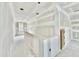 Upstairs hallway features a railing and doorway awaiting completion, with natural light from the window ahead at 2628 Silver Gate Ct, Wake Forest, NC 27587