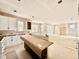 Kitchen with white cabinets, a kitchen island, and a sliding glass door at 2628 Silver Gate Ct, Wake Forest, NC 27587