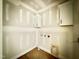A utility room with white cabinets and hook ups ready for a washer and dryer to be installed at 2628 Silver Gate Ct, Wake Forest, NC 27587