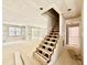 Spacious living room with unfinished staircase and access to back porch at 2628 Silver Gate Ct, Wake Forest, NC 27587