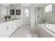 Elegant bathroom with a double vanity, soaking tub, and separate glass-enclosed shower at 296 Two Creeks Lp, Chapel Hill, NC 27517
