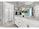 Chic bathroom with patterned wallpaper, double vanity, black and white accents, and a shower with a curtain at 296 Two Creeks Lp, Chapel Hill, NC 27517