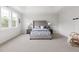 Spacious primary bedroom featuring a trey ceiling, carpet, a plush bed, and a decorative chair at 296 Two Creeks Lp, Chapel Hill, NC 27517