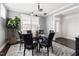 Elegant dining room with modern lighting and seating for six at 296 Two Creeks Lp, Chapel Hill, NC 27517