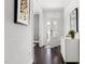 Inviting entryway with hardwood floors, white trim, and stylish decor at 296 Two Creeks Lp, Chapel Hill, NC 27517