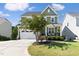 Two-story craftsman home with front porch and landscaped lawn at 296 Two Creeks Lp, Chapel Hill, NC 27517