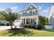 Two-story craftsman home with front porch and landscaped lawn at 296 Two Creeks Lp, Chapel Hill, NC 27517