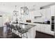 Bright kitchen featuring an island with bar seating and a view to the dining area at 296 Two Creeks Lp, Chapel Hill, NC 27517
