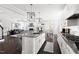 Open-concept kitchen with island, pendant lighting, and stainless steel appliances at 296 Two Creeks Lp, Chapel Hill, NC 27517