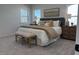 A modern bedroom with neutral walls and carpet with windows on two walls at 4327 Emeline Way # 10, Fuquay Varina, NC 27526