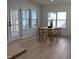 Bright dining area with natural wood table and chairs, and a view of the backyard at 4327 Emeline Way # 10, Fuquay Varina, NC 27526